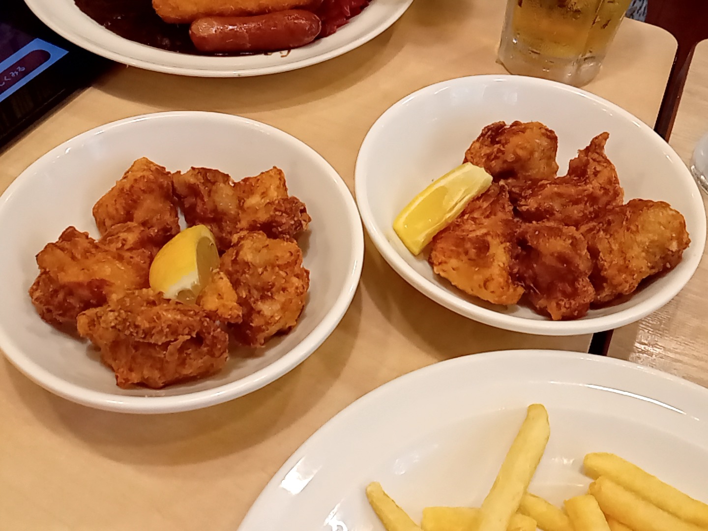 Plates of food on a restaurant table.